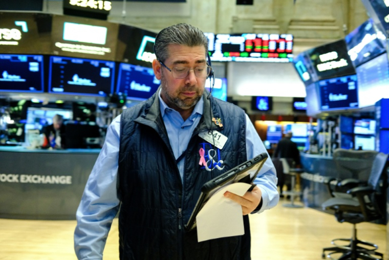 Un opérateur à la Bourse de New York le 16 décembre 2025 ( AFP / CHARLY TRIBALLEAU )