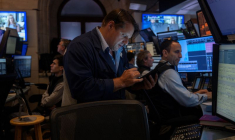 Traders work on the floor at the New York Stock Exchange (NYSE) in New York City