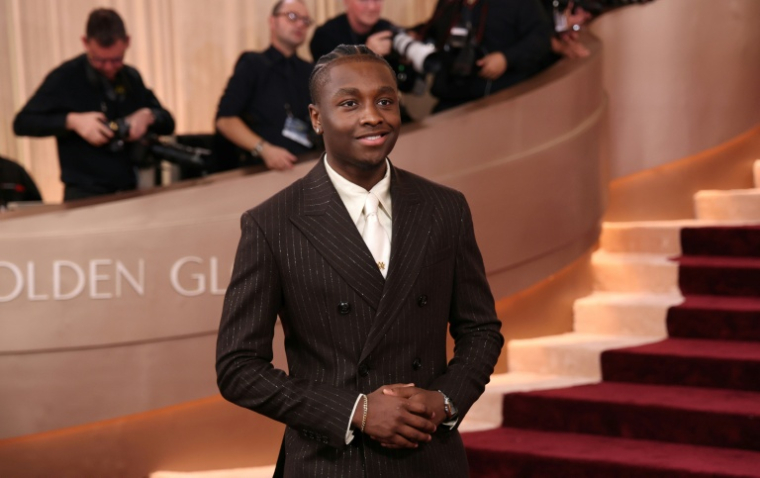L'acteur américain Miles Caton, membre du casting du film "Sinners", arrive à la 83e cérémonie des Golden Globes, le 11 janvier 2026 ( AFP / Michael Tran )