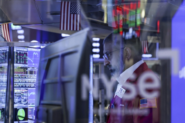 Un trader à la Bourse de New York, le 24 mars 2026 ( AFP / ANGELA WEISS )