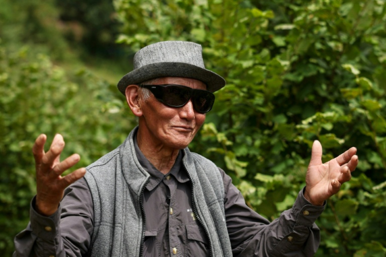 L'agriculteur bhoutanais Dawa Dhendup, 82 ans, le 29 août 2026 à Thimphou  ( AFP / Niharika KULKARNI )