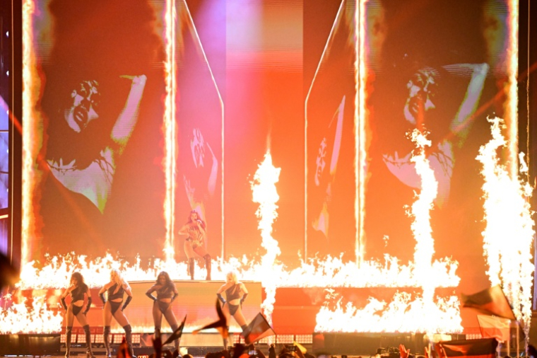 Sarah Engels, representing Germany, is making full use of the flame effects during her song 'Fire' ( AFP / Tobias SCHWARZ )