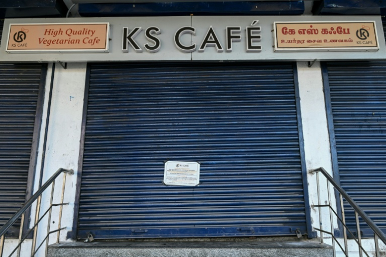 Ce restaurant a dû fermer en raison de la rupture d'approvisionnement en gaz avec les difficultés d'importation consécutives à la guerre au Moyen-Orient, le 10 mars 2026 ( AFP / R. Satish BABU )