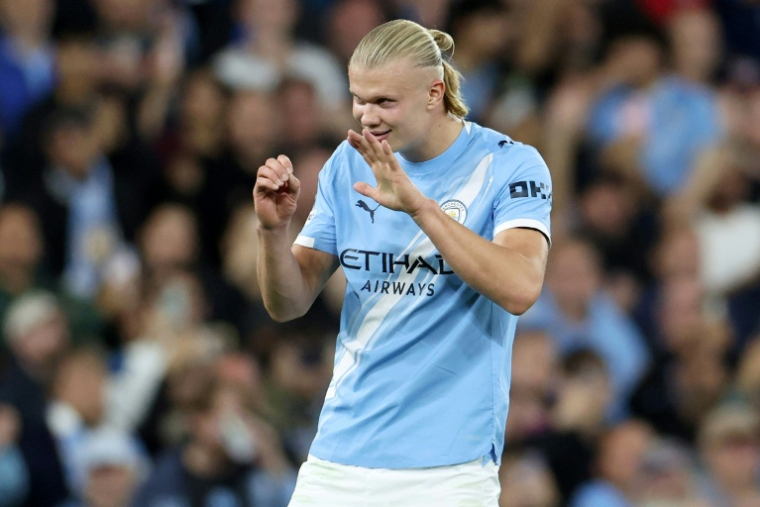 L'attaquant norvégien de Manchester City Erling Haaland célèbre son 50e but marqué en Ligue des champions, contre Naples le 18 septembre 2025 à Manchester ( AFP / Darren Staples )