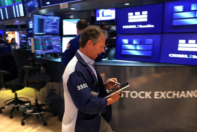 Trader sur le parquet du New York Stock Exchange (NYSE), le 14 mai 2026 ( AFP / TIMOTHY A. CLARY )