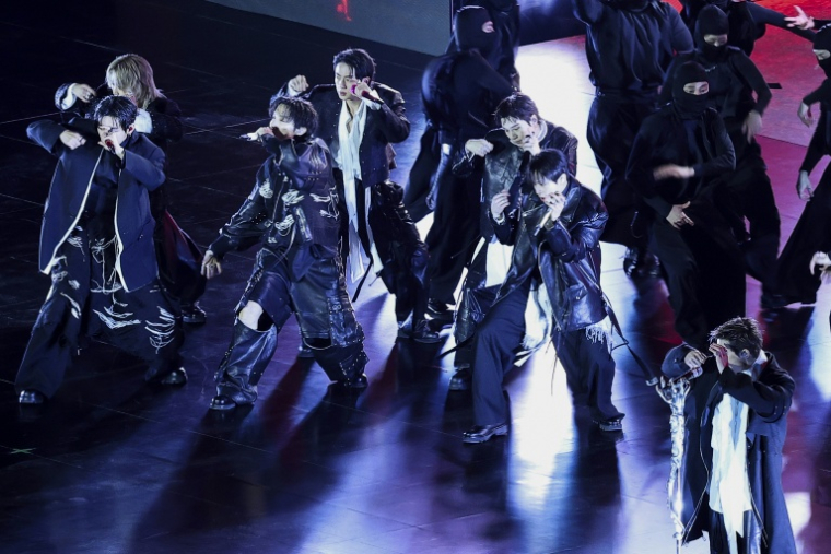 Les membres du groupe de K-pop BTS lors du concert marquant leur retour sur la place Gwanghwamun à Séoul, le 21 mars 2026, en Corée du Sud ( POOL / Kim Hong-Ji )