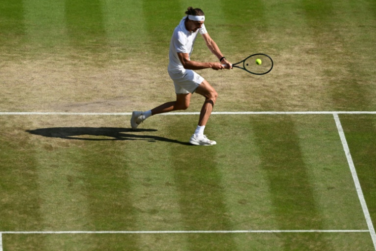 Le N.3 mondial Alexander Zverev contre l'Américain Taylor Fritz (7e) en quarts de finale de Wimbledon le 8 juillet 2026 à Londres ( AFP / Kirill KUDRYAVTSEV )