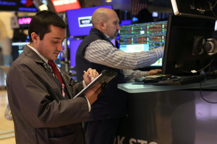 Des opérateurs à la Bourse de New York le 14 janvier 2026 ( AFP / TIMOTHY A. CLARY )