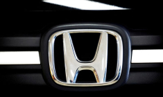FILE PHOTO: A logo of Honda is seen inside a car dealer in Nijmegen