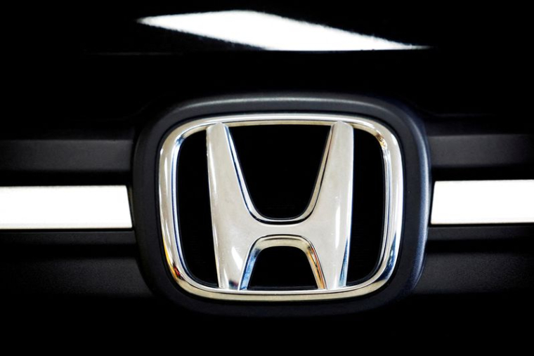 FILE PHOTO: A logo of Honda is seen inside a car dealer in Nijmegen