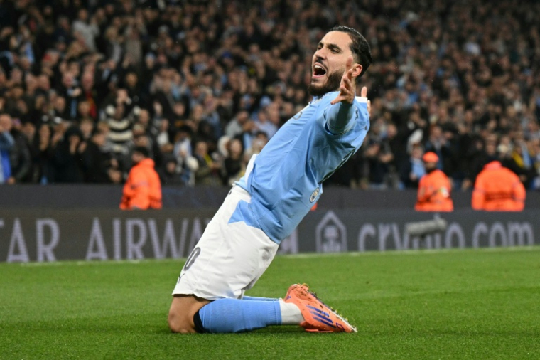 Le milieu Français de Manchester City Rayan Cherki célèbre son but mercredi soir en Ligue des champions, le quatrième de son équipe contre Dortmund. ( AFP / Oli SCARFF )