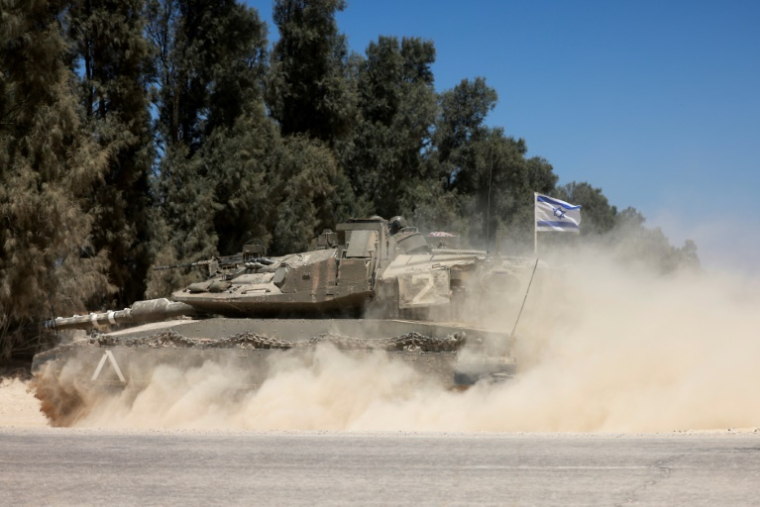 Des troupes israéliennes sont déployées près de la frontière entre Israël et la bande de Gaza, le 8 mai 2025, dans le contexte de la guerre entre Israël et le mouvement islamiste palestinien Hamas ( AFP / Menahem KAHANA )
