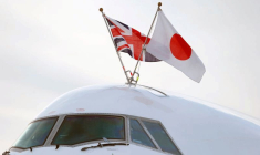 Flags of Japan and the United Kingdom are seen on the aircraft carrying Japan's Prime Minister Shinzo Abe as he arrives to attend the Enniskillen G8 summit, at Belfast International Airport