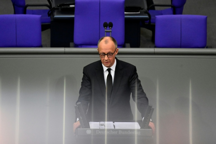 Le chancelier allemand Friedrich Merz prononce un discours au Bundestag, à Berlin, le 24 février 2026 ( AFP / John MACDOUGALL )