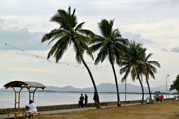 Residents spend their morning on a beach next to the port in Nadi on October 4, 2026, ahead of the Pacific Pre-COP31 Summit's opening ceremony. ( AFP / SAEED KHAN )