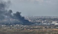 A drone view shows smoke above Beit Hanoun in the Gaza Strip, as seen from near Kibbutz Nir Am in southern Israel