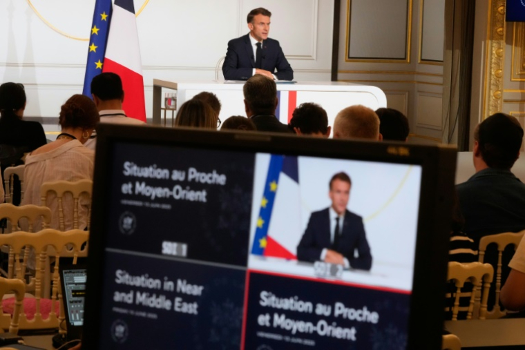 Le président Emmanuel Macron s'exprime à l'Elysée le 13 avril 2025 à Paris ( POOL / Michel Euler )