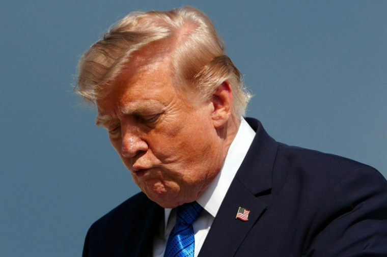 Le président américain Donald Trump descend d'Air Force One à Morristown, dans le New Jersey, le 31 juillet 2026 ( AFP / Aaron Schwartz )
