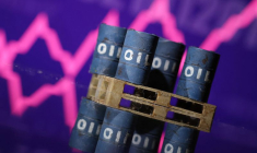 Illustration de barils de pétrole devant un graphique boursier