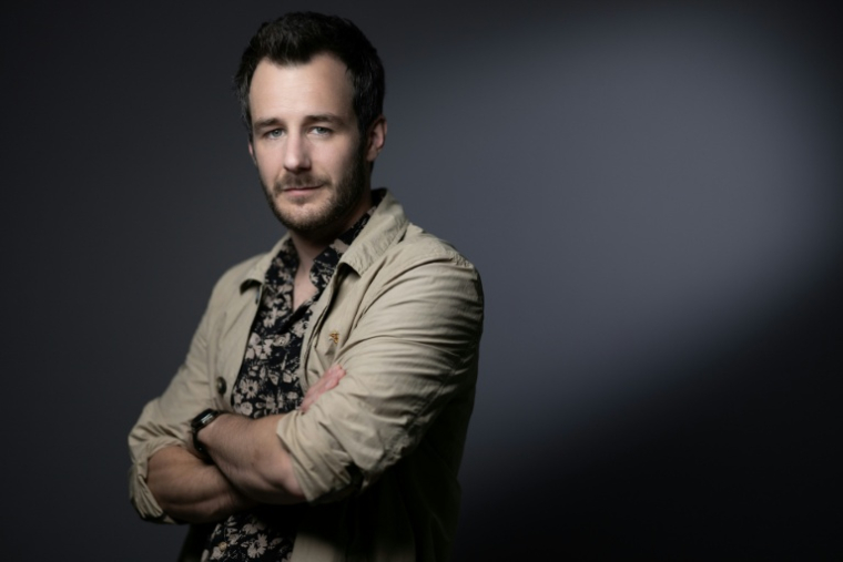 L'acteur et réalisateur Bertrand Usclat pose 6 avril 2024 lors du festival de Cannes ( AFP / JOEL SAGET )