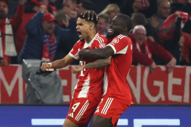 Luis Diaz, auteur du troisième but du Bayern, et Dayot Upamecano exultent face au Real Madrid, le 15 avril 2026 à Munich ( AFP / Karl-Josef HILDENBRAND )