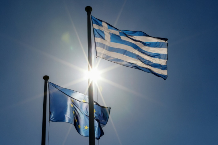 La Grèce va rembourser plus tôt que prévu une partie de sa dette octroyée par les pays européens pour parer à la crise financière de 2010 ( AFP / David GANNON )