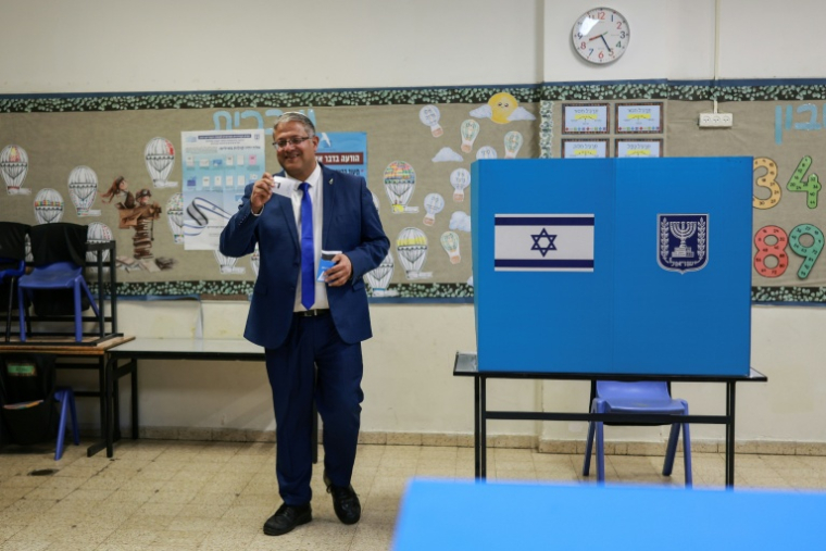 Far-right Otzma Yehudit party leader Itamar Ben Gvir prepares to cast his ballot at a polling station in the settlement of Kiryat Arba, in the Israeli-occupied West Bank, on October 27, 2026, on the day of Israel's legislative election. ( AFP / Ilia YEFIMOVICH )