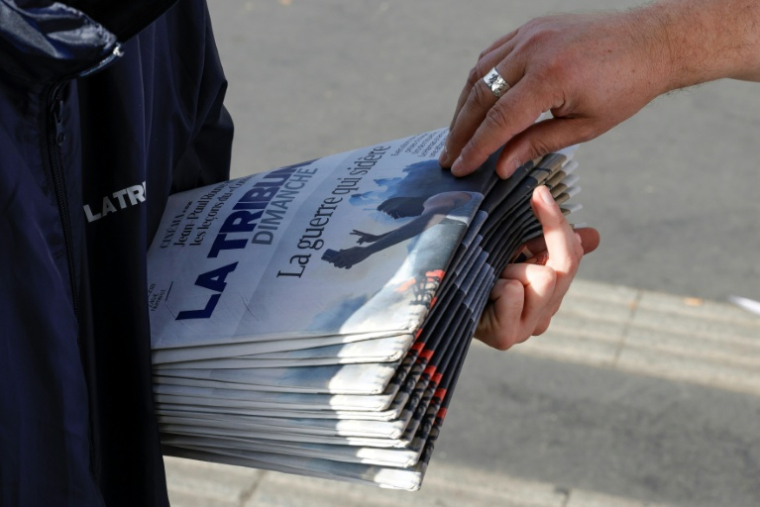 Le groupe CMA Media veut réunir les rédactions numériques de son journal La Tribune et de sa chaîne télé BFM Business pour créer un pôle d'information économique commun ( AFP / Geoffroy Van der Hasselt )