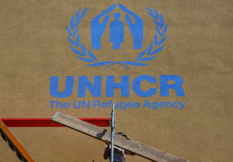 Un logo de l'agence de l'ONU pour les réfugiés, à Berlin, le 16 juin 2022 ( AFP / John MACDOUGALL )