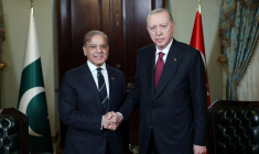 Turkey’s President Erdogan shakes hands with Pakistan's PM Sharif before their meeting in Istanbul