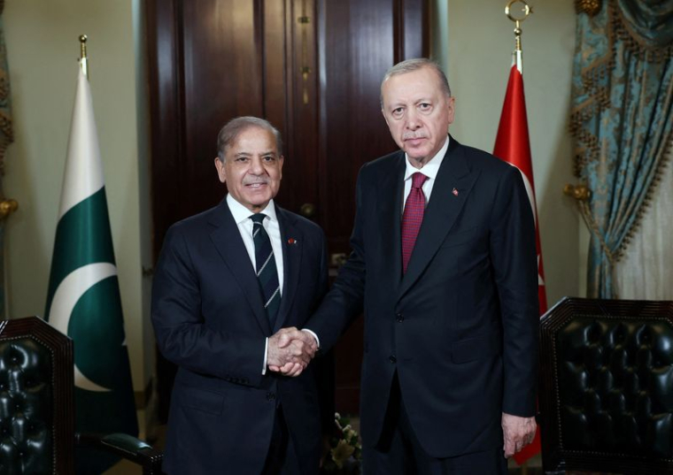 Turkey’s President Erdogan shakes hands with Pakistan's PM Sharif before their meeting in Istanbul
