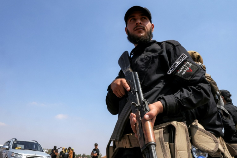 Les forces gouvernementales syriennes se déploient à Busra al-Harir, dans la province de Deraa, dans le sud de la Syrie, le 21 juillet 2025 ( AFP / Bakr ALkasem )