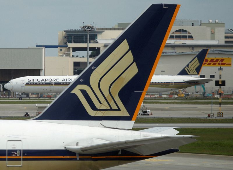 Les avions de Singapore Airlines sur le tarmac de l'aéroport de Changi à Singapour