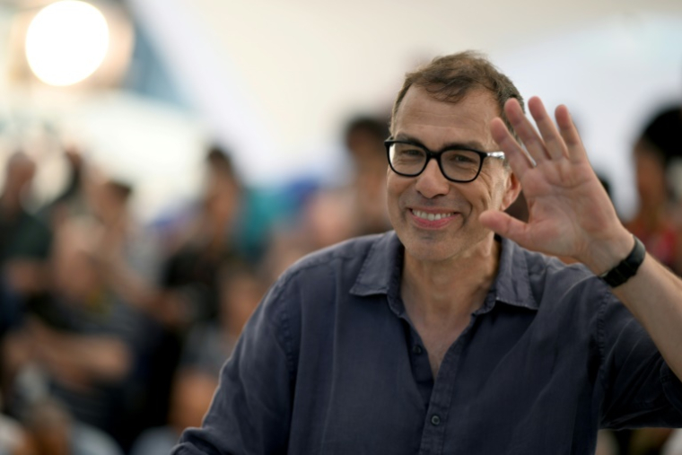 Le réalisateur français Dominik Moll lors d'un photocall pour le film "La Nuit du 12" au 75e Festival de Cannes, le 21 mai 2022 ( AFP / PATRICIA DE MELO MOREIRA )