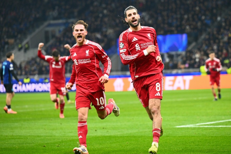 Le milieu de Liverpool Dominik Szoboszlai  (à droite) après son penalty victorieux contre l'Inter Milan en Ligue des champions, le 9 décembre 2025 ( AFP / Stefano RELLANDINI )