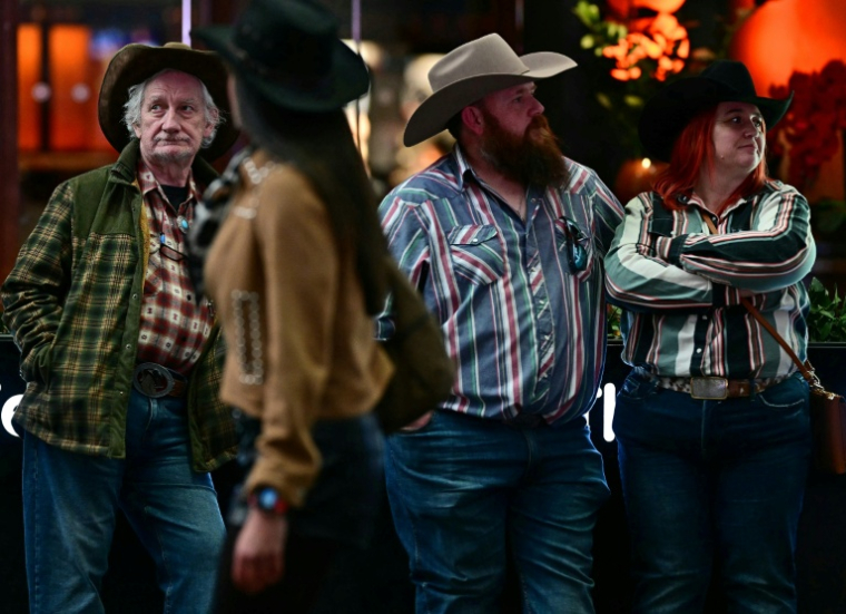 Des fans de musique country participent au festival Country to Country (C2C), le 13 mars 2026 à Londres ( AFP / Ben STANSALL )