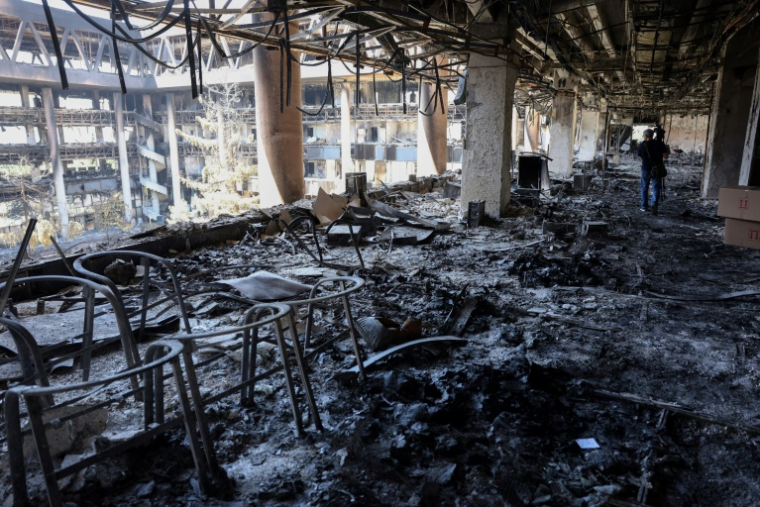 Destructions dans le bâtiment de la Radio-télévision iranienne à Téhéran après avoir été frappé il y a quelques jours par un raid israélien, le 19 juin 2025 ( AFP / - )