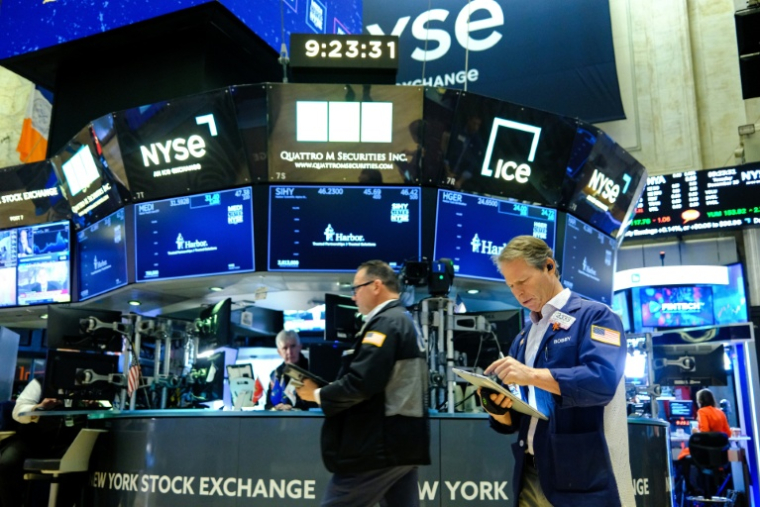 Des opérateurs à la Bourse de New York, le 16 décembre 2025 ( AFP / CHARLY TRIBALLEAU )