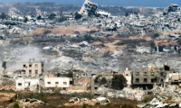 Une photo prise depuis le sud d'Israël montre les destructions dans la bande de Gaza, le 29 juillet 2025 ( AFP / Jack GUEZ )