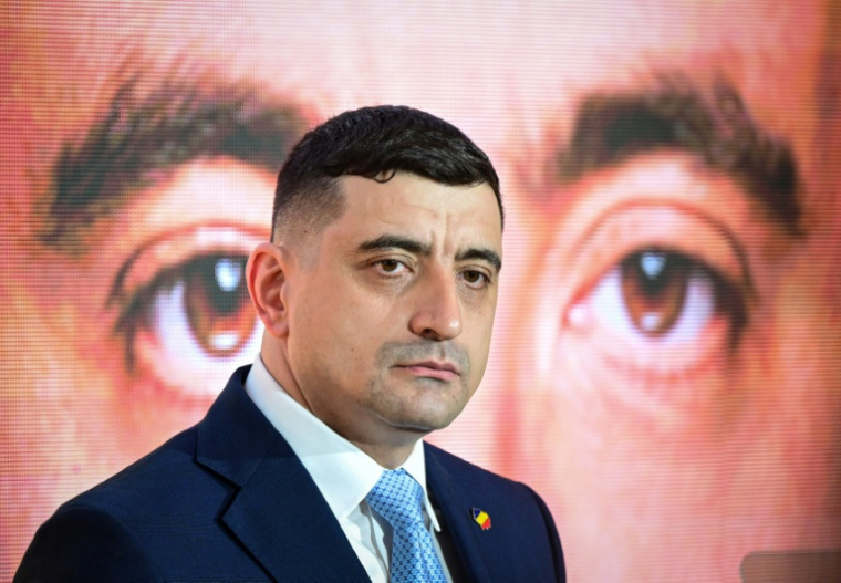 Le chef du parti nationaliste AUR George Simion, le 14 mars 2025 à Bucarest ( AFP / Daniel MIHAILESCU )