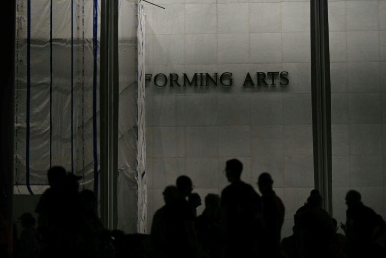 Manifestation pour la défense du Kennedy Center, haut lieu culturel de Washington que le président américain Donald Trump menace de condamner si son nom n'y est pas accolé, le 18 septembre 2026 à Washington ( AFP / Kent NISHIMURA )