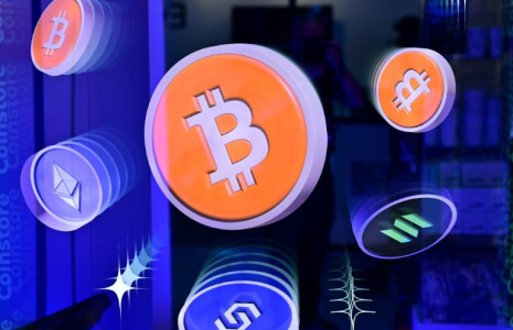 Logos du bitcoin et d'autres crypto-monnaies ( AFP / Giuseppe CACACE )