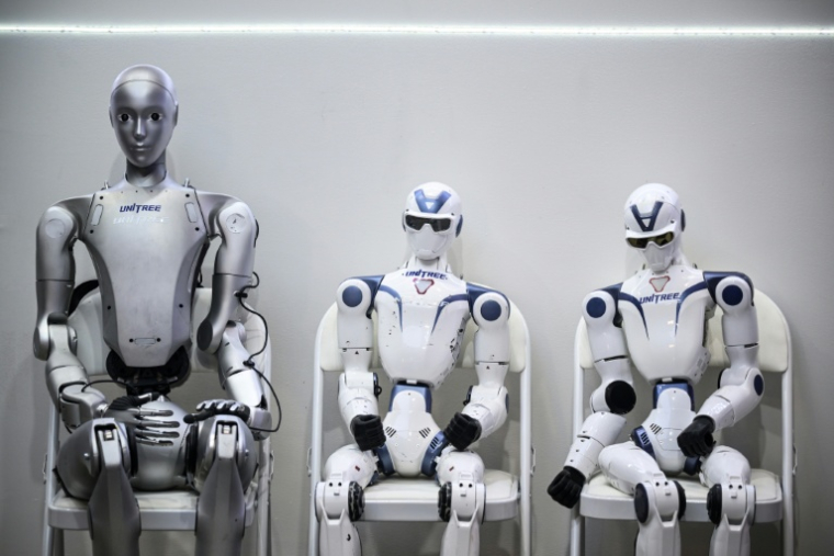 Des robots de la société Unitree Robotics exposés au salon VivaTech, le 17 juin 2026 à Paris ( AFP / JULIEN DE ROSA )