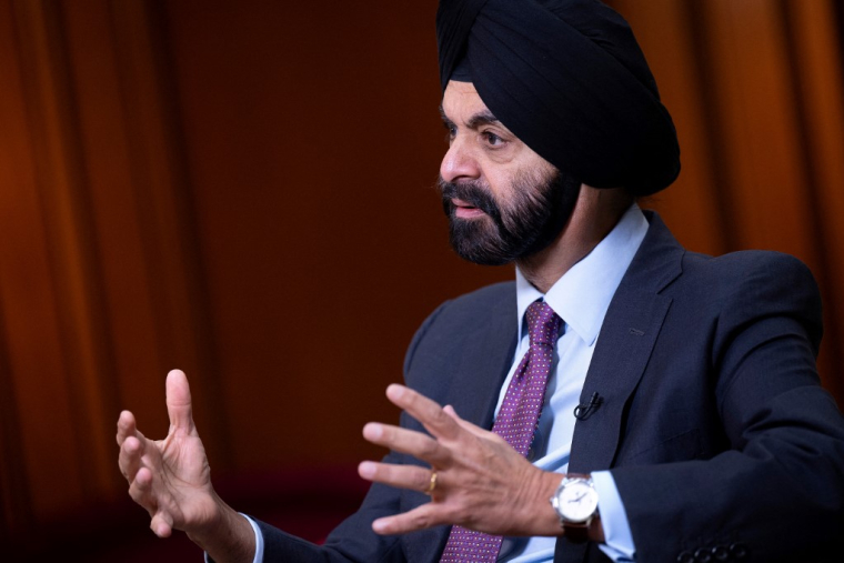 The World Bank recently committed to increasing its climate financing from 35 percent of total lending to 45 percent for the financial year ending June 30, 2025, with the money split between climate change adaptation and mitigation. The bank almost reached the 45 percent target last year, and is on track to beat it this year, World Bank president Ajay Banga said in an interview ahead of the IMF World Bank Annual Meetings in Washington next week."But what's inside the 45 is very important," he said, calling climate change adaptation policies like building climate-resilient infrastructure "development done smart." (Photo by Brendan Smialowski / AFP) ( AFP / BRENDAN SMIALOWSKI )