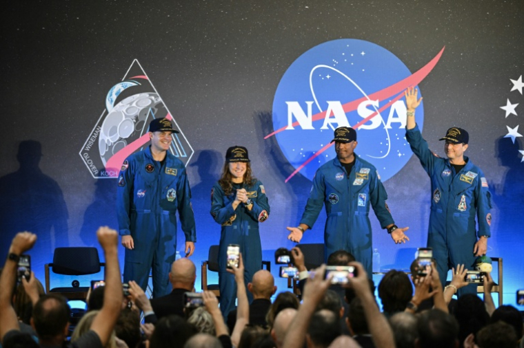 Cérémonie de bienvenue pour les astronautes d'Artemis II, le 11 avril 202- à Houston (de gauche à droite: le Canadien Jeremy Hansen, Christina Koch, Victor Glover et le commandant Reid Wiseman) ( AFP / RONALDO SCHEMIDT )