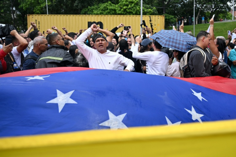 Des manifestants demandent le retour au Venezuela de l'opposante Maria Corina Machado, le 24 septembre 2026 à Caracas ( AFP / Juan BARRETO )