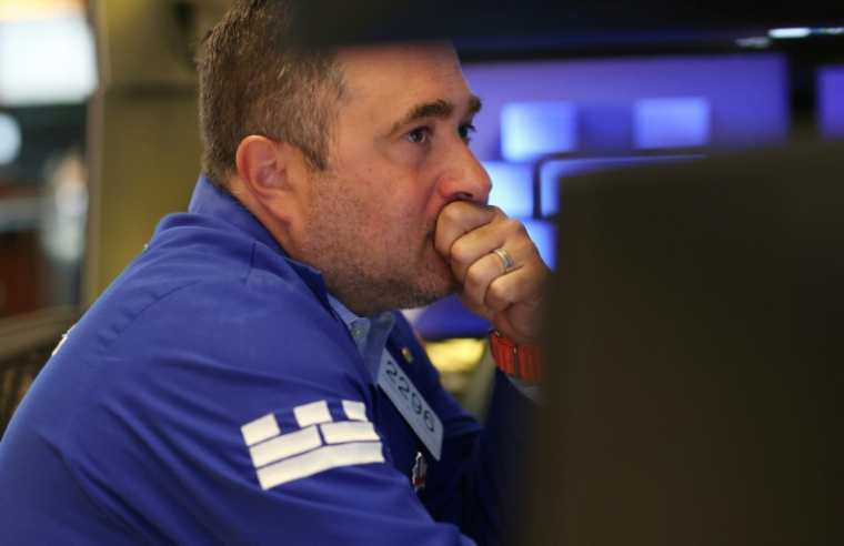 Un opérateur à la Bourse de New York le 14 juillet 2026 ( AFP / TIMOTHY A. CLARY )
