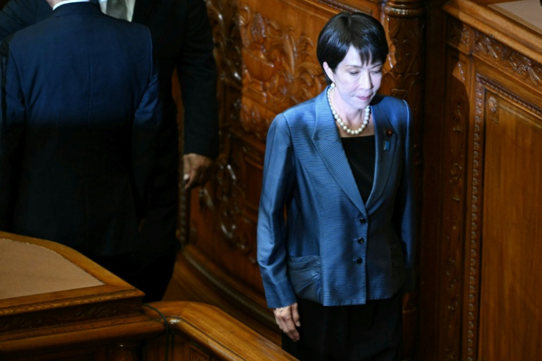 La présidente du Parti libéral démocrate (PLD), Sanae Takaichi, retourne à son siège après avoir voté pour la nomination d'un nouveau Premier ministre du Japon lors d'une session extraordinaire de la chambre basse du Parlement à Tokyo, le 21 octobre 2025 ( AFP / Philip FONG )