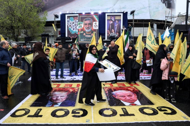 Des manifestants lors de la Journée de Qods, occasion annuelle de manifestations en solidarité avec les Palestiniens, à Téhéran, le 13 mars 2026 ( AFP / - )