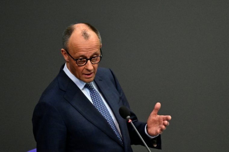 Le chancelier allemand Friedrich Merz, le 25 mars 2026 au Bundestag, à Berlin ( AFP / John MACDOUGALL )